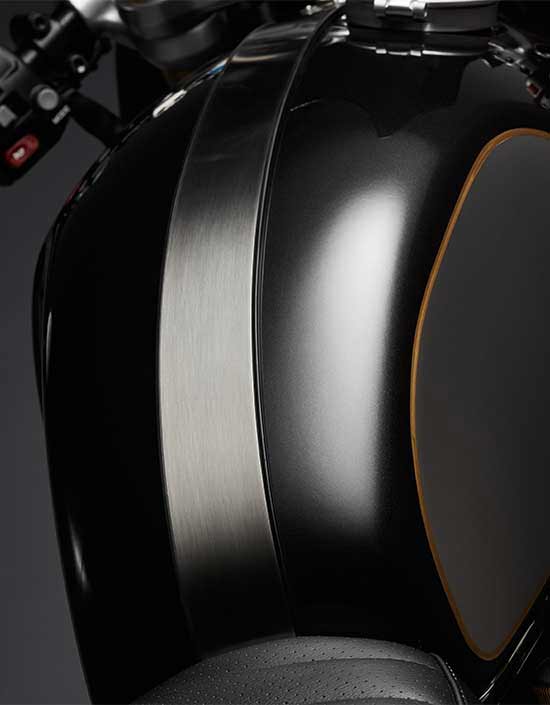 Triumph Thruxton TFC fuel tank featuring carbon fibre paint scheme with gold coachlines